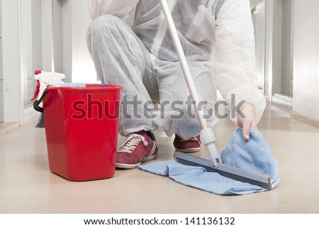 Man in Overall Cleansing Spatula with Towel