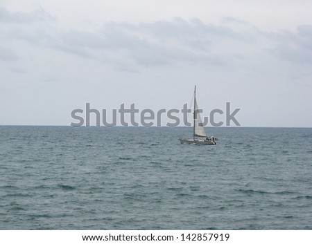A small boat in the middle of the sea.