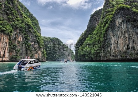 PHI PHI ISLAND, THAILAND - AUG 11: Tourists enjoy wonderful thai nature, August 11, 2009 in Phi Phi Island, Thailand. Ko Phi Phi was devastated by the Indian Ocean Tsunami of December 2004.