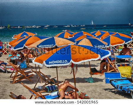 SICILY, ITALY - AUG 10: Tourists enjoy beach life, August 10, 2007 in Sicily, Italy. The region attracts five million tourists every year.
