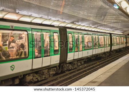 PARIS, DEC 4: Underground train inside a metro station, December 4, 2012 in Paris. Paris Metro is the 2nd largest underground system worldwide by number of stations (300)