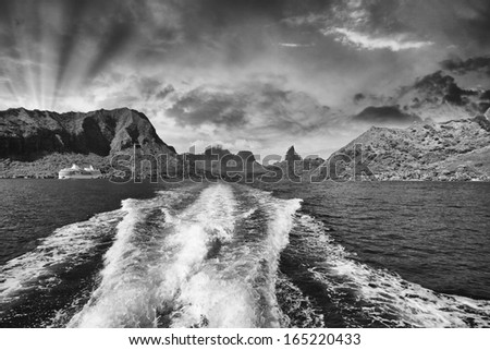 Polynesia Islands, Black and white seascape with boat wake.