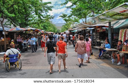 BANGKOK - AUG 18: Tourists and locals enjoy a street market, Augus 18, 2008 in Bangkok. Street markets are one of the most popular city tourist attraction.
