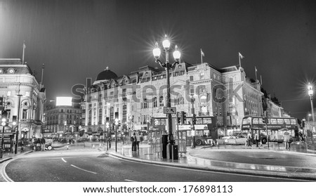 LONDON - SEP 17, 2013: Traffic and Double Decker Buses in Piccadilly Circus at night. Piccadilly Circus is a famous public space in London\'s West End, it was built in 1819.