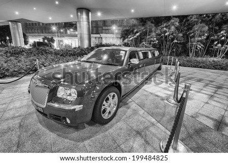 COTAI STRIP, MACAU - APRIL 22, 2014: Red Limousine in Casino parking. Macau is rivaling Las Vegas in gambling revenues, surpassing american city in 2007