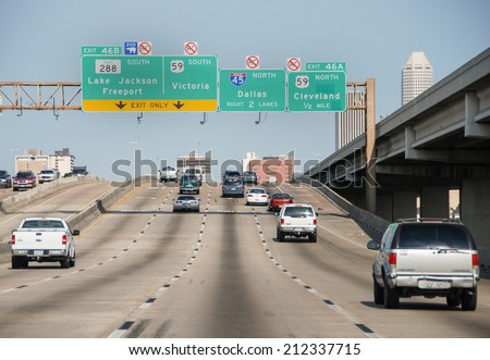 HOUSTON, TX - MAR 1, 2009: Traffic flows on the interstate to Houston, TX. Traffic congestions are a often a problem for many people going in and out.