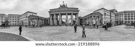 BERLIN - OCTOBER 11, 2013: Tourists walk in Pariser Platz. More than 25 million people visit the city every year.