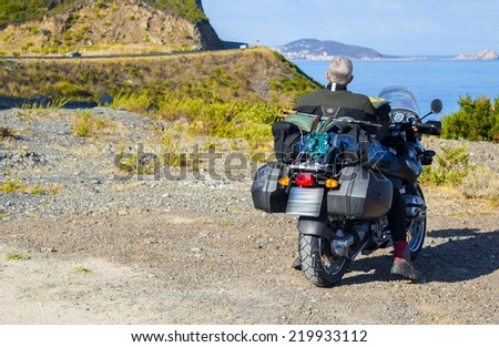 Motorbike travel and adventure on the shore of beautiful coast.