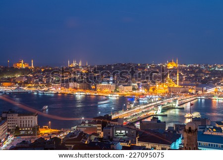 ISTANBUL - SEPTEMBER 17, 2014: City night panorama with Blue Mosque and Hagia Sophia on background. Istanbul is visited by more than 11 million people every year.