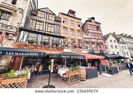 ROUEN, FRANCE - JUNE 17, 2014: Joan\'s D\'arc square with tourists in Rouen, Normandy, France. Around 1.5 million tourists flock to Rouen each year.