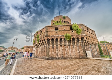 ROME - MAY 20, 2014: Tourists visit Saint Angel Castle. The city is visited by more than 10 million people every year.