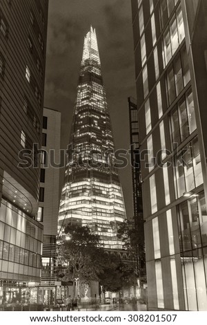 LONDON - JUNE 11: Overview of London with the Shard of Glass between buildings on June 11, 2015 in London, UK. Standing 306 metres high, the Shard is currently the tallest building in the EU