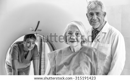 Happy doctors and patients in hospital clinic.