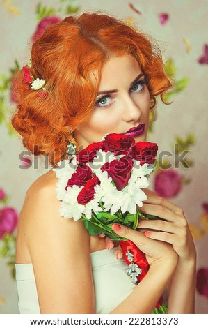 Young beautiful bride with red hair and a bouquet