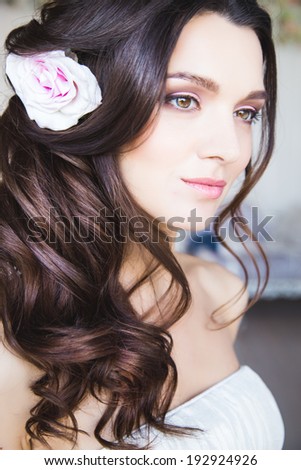close-up portrait of beautiful bride girl with perfect makeup and hair style