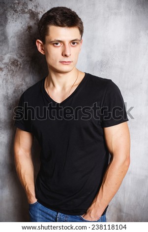 Close-up portrait of gorgeous young man in black t-shirt