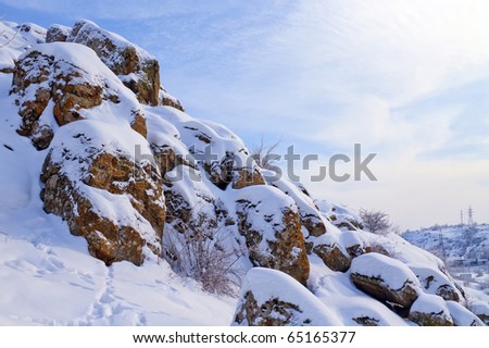 Attractive winter landscape with spotted rocks