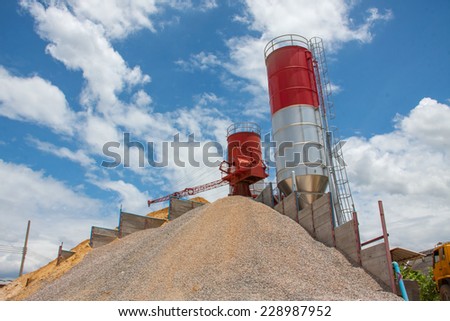 concrete batching plant, heap of sand and gravel, cement material stationary