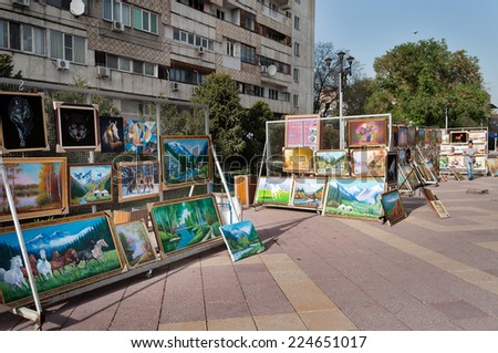 ALMATY, KAZAKHSTAN - MAY 6, 2014: Pedestrian zone street Jibek Joly. Arbat Shopping street is a nice place to visit when visiting Almaty, as it\'s filled with artists selling their works