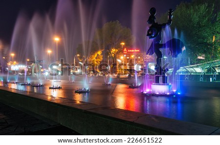 ALMATY, KAZAKHSTAN - MAY 7, 2014: Fountain near the circus at night. Almaty is the largest city in Kazakhstan, and was the country\'s capital until 1997