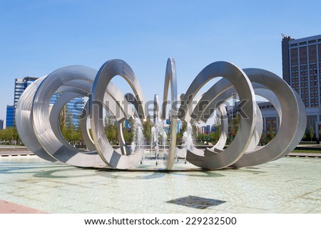 ASTANA, KAZAKHSTAN - MAY 10, 2014: Fountain Horseshoe and Wheel in Square of love. Astana is the capital city of Kazakhstan.  Population of 835153