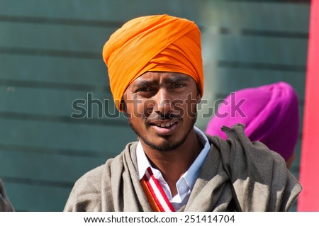 AMRITSAR, INDIA, DEC - 7, 2014: Unidentified Indian Young Sikh man on street in Amritsar, Punjab. It is home to the Harmandir Sahib (Golden Temple), the spiritual and cultural center for Sikh religion