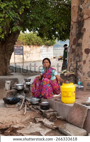 ORCHHA, INDIA - DEC 19, 2014: Unidentified Indian woman cooking food on the street