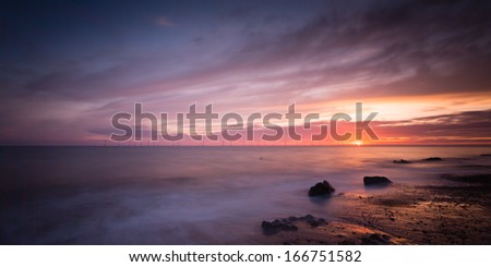 Caister beach just as the sun rose over the sea turning night into daylight on this lovely piece of Norfolk\'s coastline