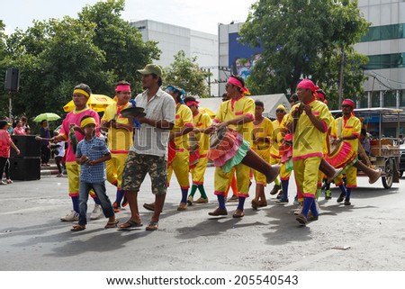 NAKHON RATCHASIMA, THAILAND - JULY 12: Thai people participate parade in grand of opening the traditional candle procession festival of Buddha, on July 12, 2014 in Nakhon Ratchasima, Thailand.