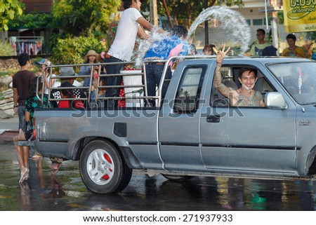 NAKHON RATCHASIMA, THAILAND - APRIL 14, 2015: Thai people playing water in Songkran festival on April 14, 2015 in Nakhon Ratchasima in Thailand