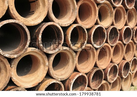 Clay pipes stacked in a warehouse