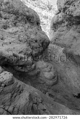 Black and white  dry desert river bed canyon gorge, Israel.