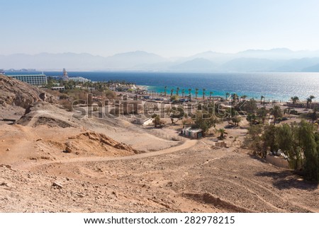 Shoreline beach hotels Eilat, Red sea, Israel, Jordan mountains.