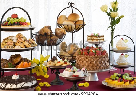 stock photo : Beautiful display of cakes, muffins, pastry, breads, cookies, pies and fruit tortes.