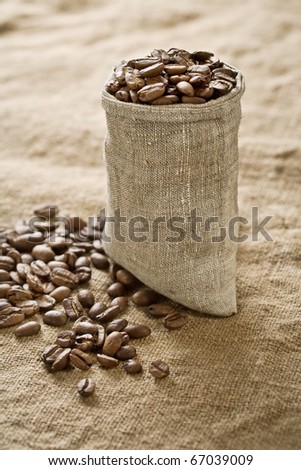 coffee grains in bag on sacking