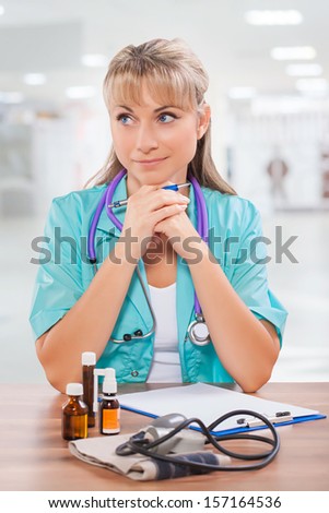 beautiful female doctor thinking