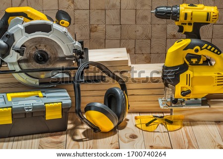 construction carpentry electric hand tools on wooden background Сток-фото © 