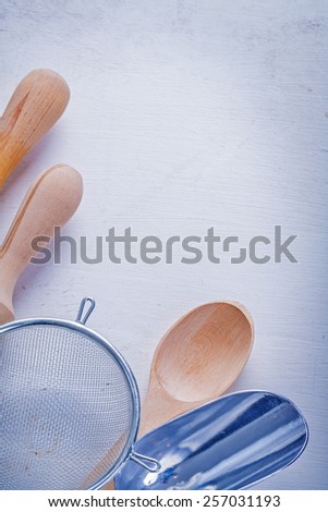 rolling pins sieve spoon scoop on white board