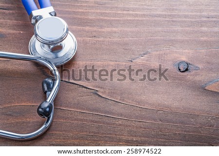 copyspace close up medical stethoscope on vintage wooden board medical comcept