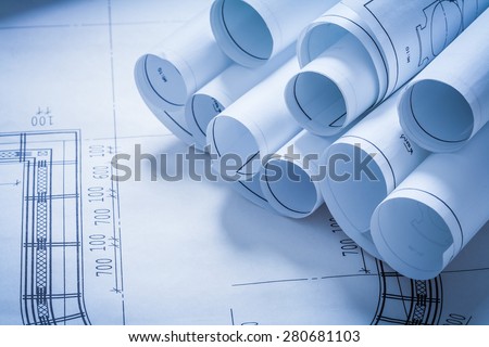 Stack of construction plans building and architecture concept
