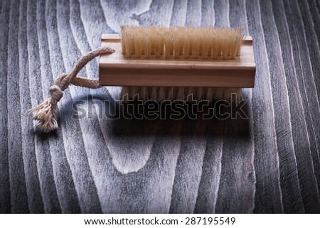Vintage wooden board with scrubbing bath brush horizontal view sauna concept