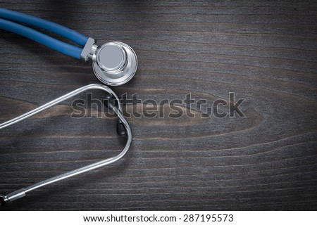 Wooden board with diagnostic medical stethoscope copy space image medicine concept