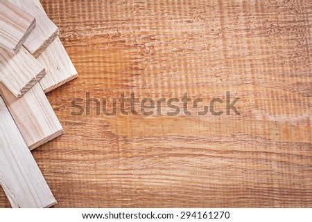 Natural wooden studs on vintage wood board copy space image construction concept.