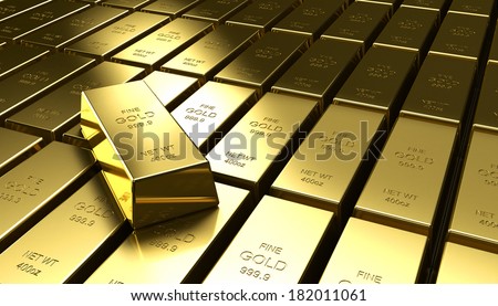 An individual gold bar on a stack of other gold bars
