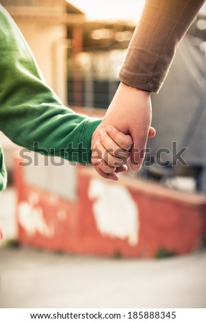 Hold my hand - Mother and son holding hands