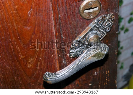 Door handle on the door of an old building