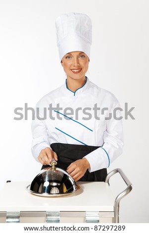 happy smiling caucasian female chef introducing new dish