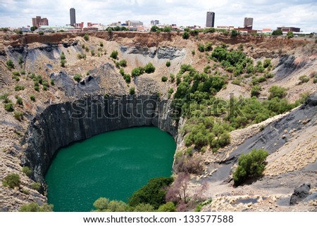 big hole in kimberley, south africa, where De Beers diamond company originated and diamonds were dug out by hand. Largest man made hole on earth