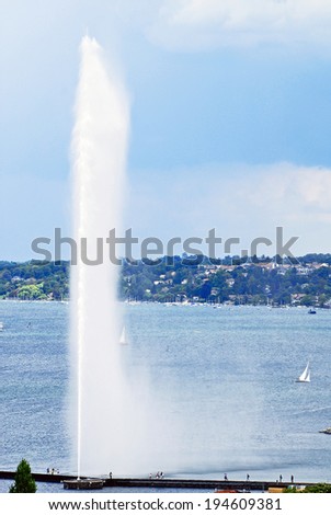 LAKE GENEVA, GENEVA/SWITZERLAND - AUGUST 17, 2006: View of Jet d\' Eau (water Jet), one of the largest fountains in the world and a famous landmark in Geneva. August 17, 2006 Geneva, Switzerland