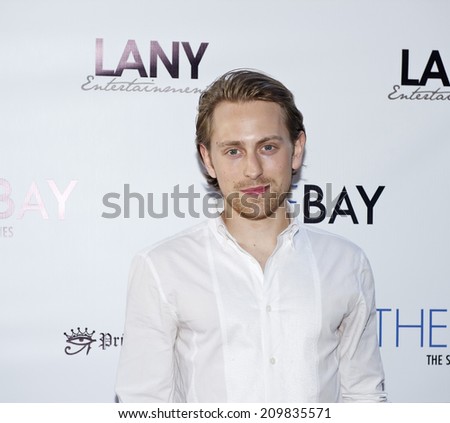 LOS ANGELES/CALIFORNIA - AUGUST 4, 2014: Actor Eric Nelson walks the red carpet at \
